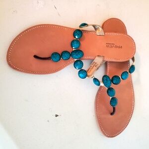 Jeweled sandals.